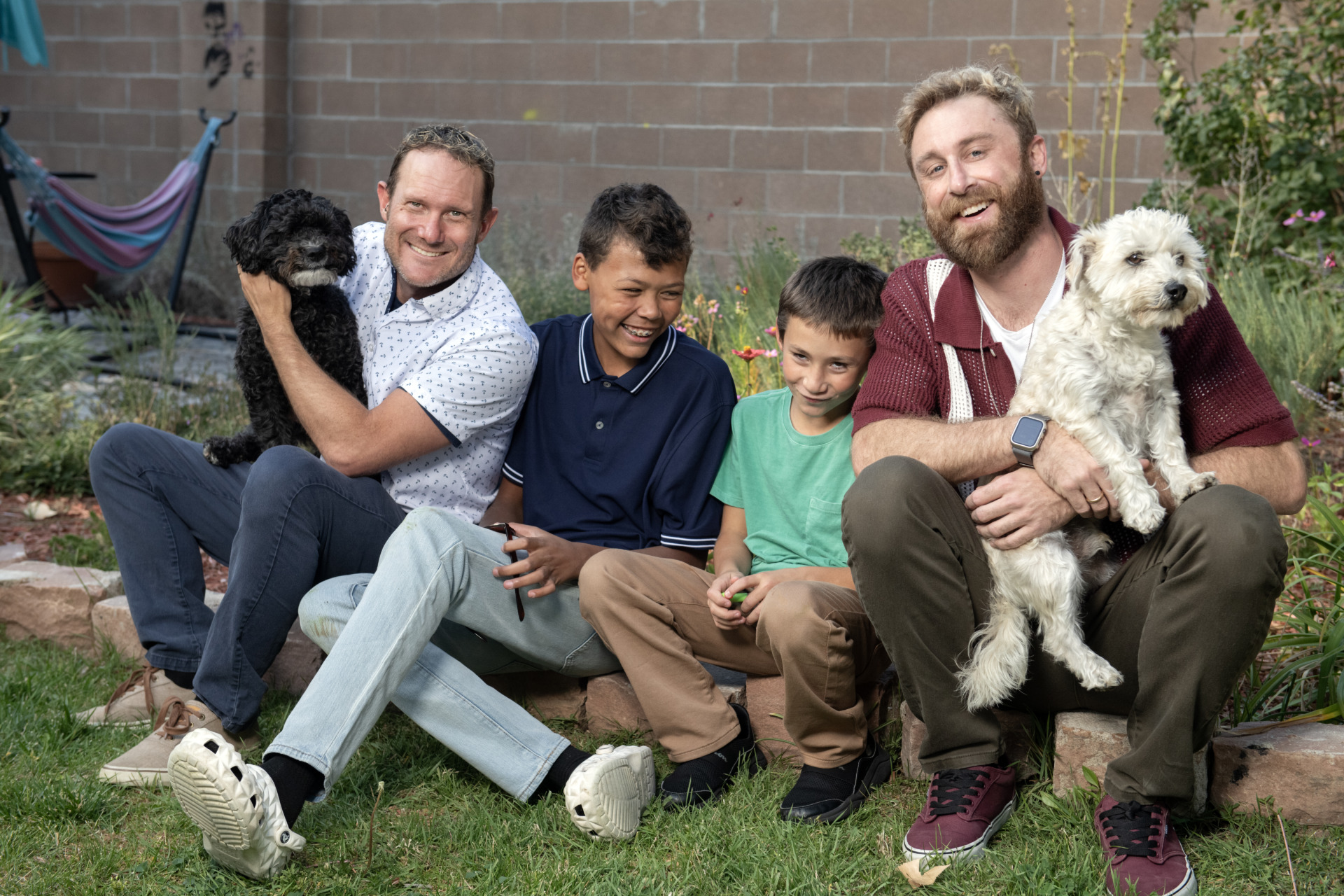 Charlie and Max with their two sons, 10 and 12, and their two dog.