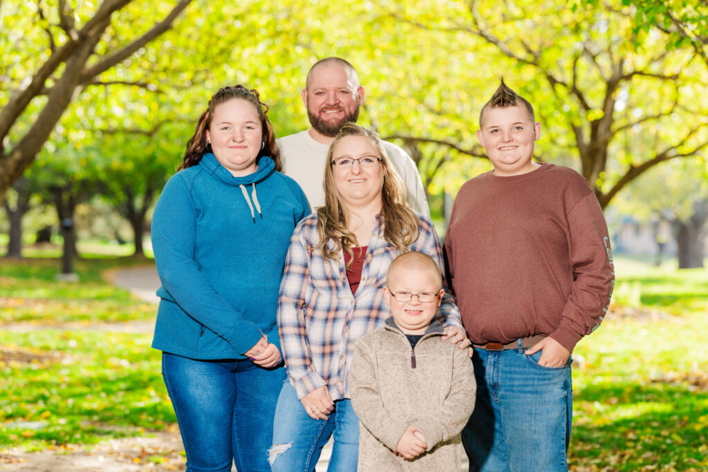 Mom and Dad with their teen son and daughter and adopted elementary aged son.